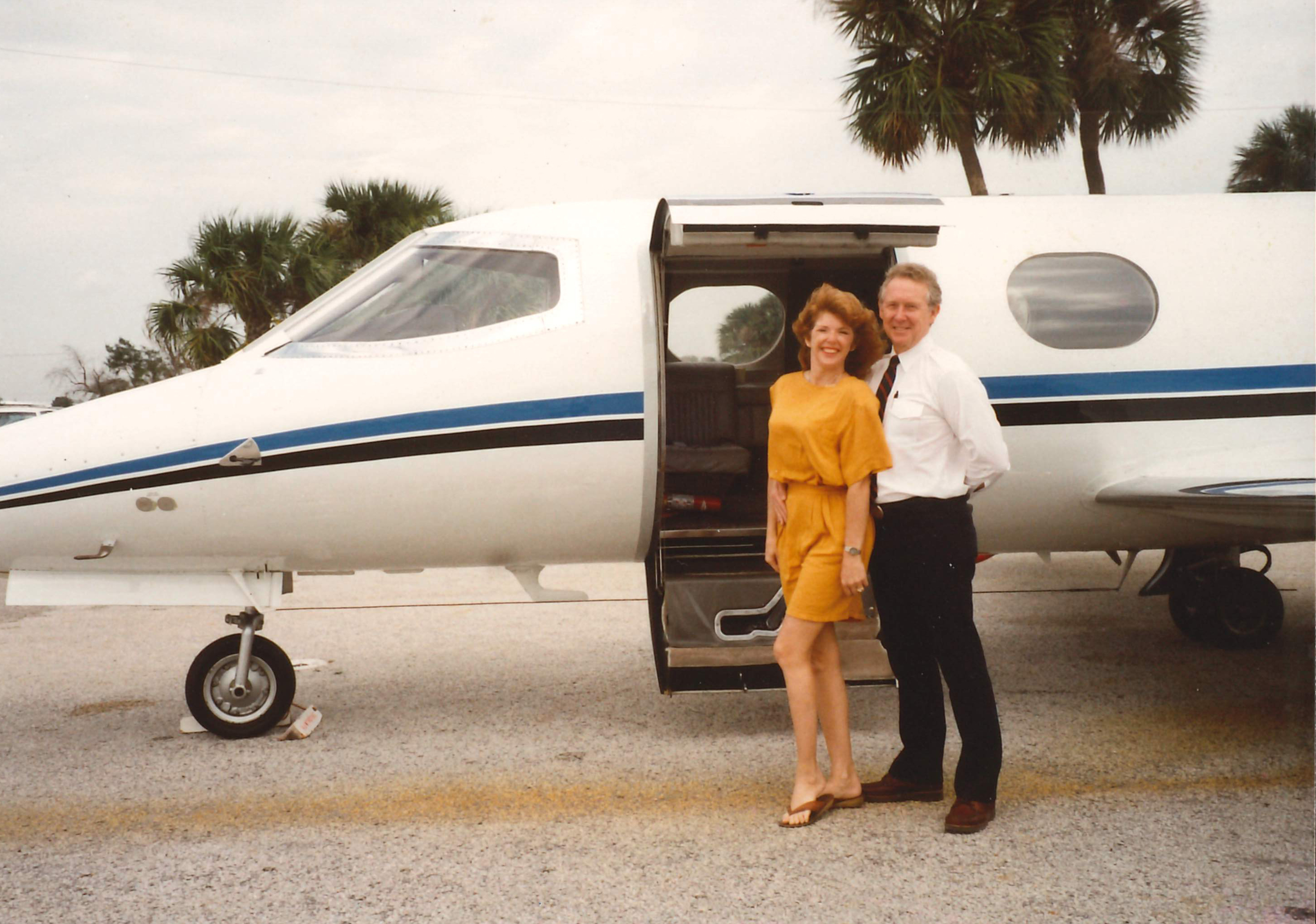 Bill and Leslie Gibson stand in front of LearJet