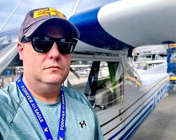Charles Williams stands in front of Cessna aircraft