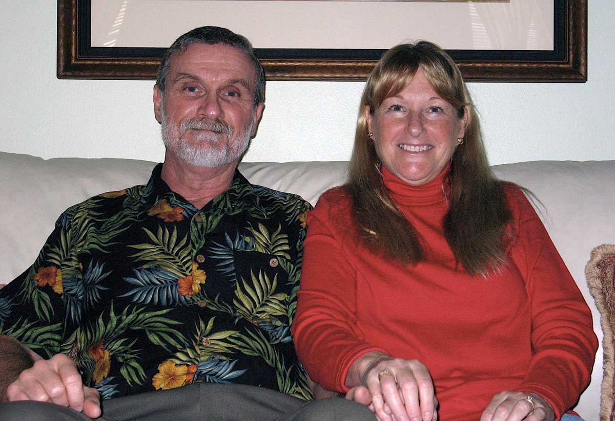 Peter and Linda Vosbury sit on couch