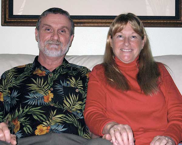 Peter and Linda Vosbury sit on couch